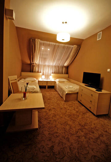 Фото номера Двухместный номер с 2 отдельными кроватями Отель Hotel Hibiskus г. Boguchwała 4